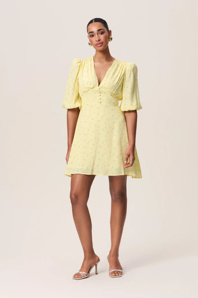 Discover the Charm of the Fontana Mini Dress: Pastel Yellow with Blue Dots